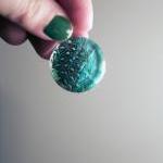 Blue Feather Pendent on Bla..
