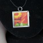 Orange Flower Pendant on Bl..