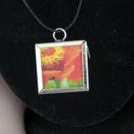 Orange Flower Pendant on Bl..