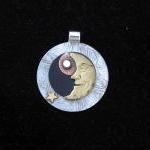 Metal Moon Pendant on Black..