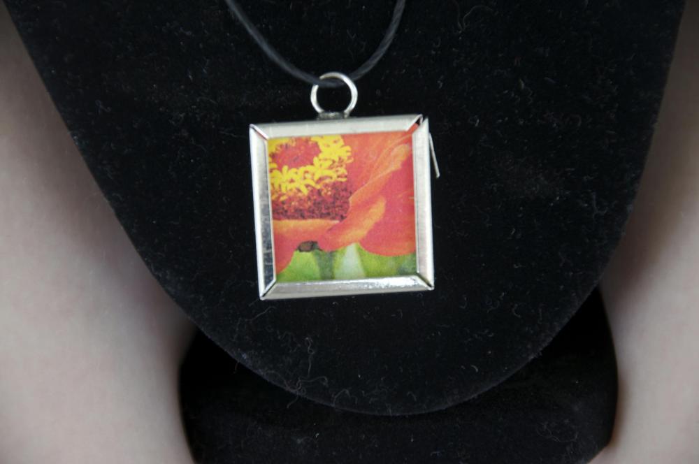 Orange Flower Pendant on Black Cord