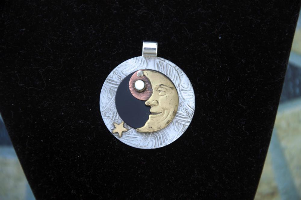 Metal Moon Pendant on Black Cord